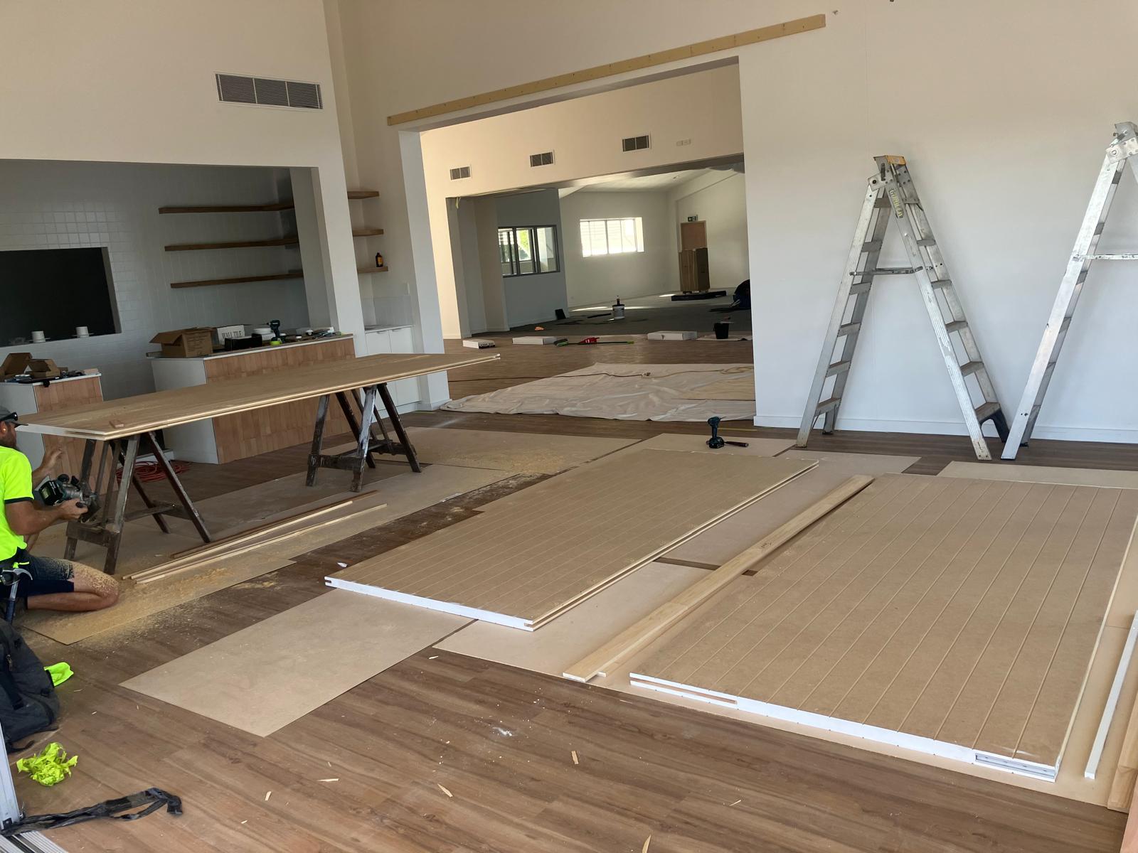 Installing wooden sliding door panel on track